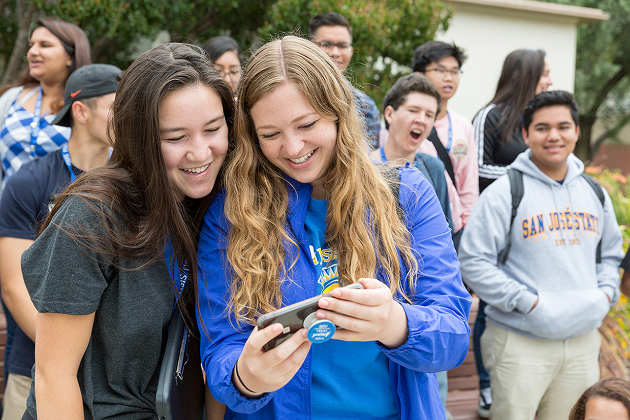 Students looking at their phone