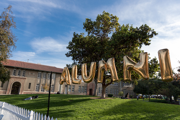 color image of gold balloons spelling the word 'alumni'