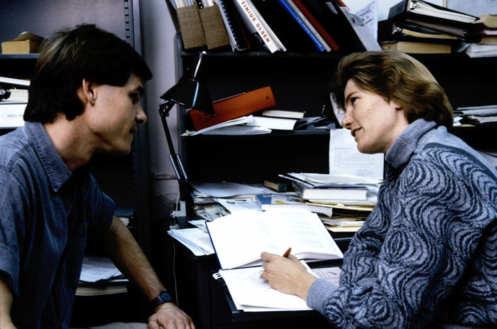 Thalia advising a student in her office in the 80's.