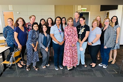 photo shows SJSU president with fifteen faculty