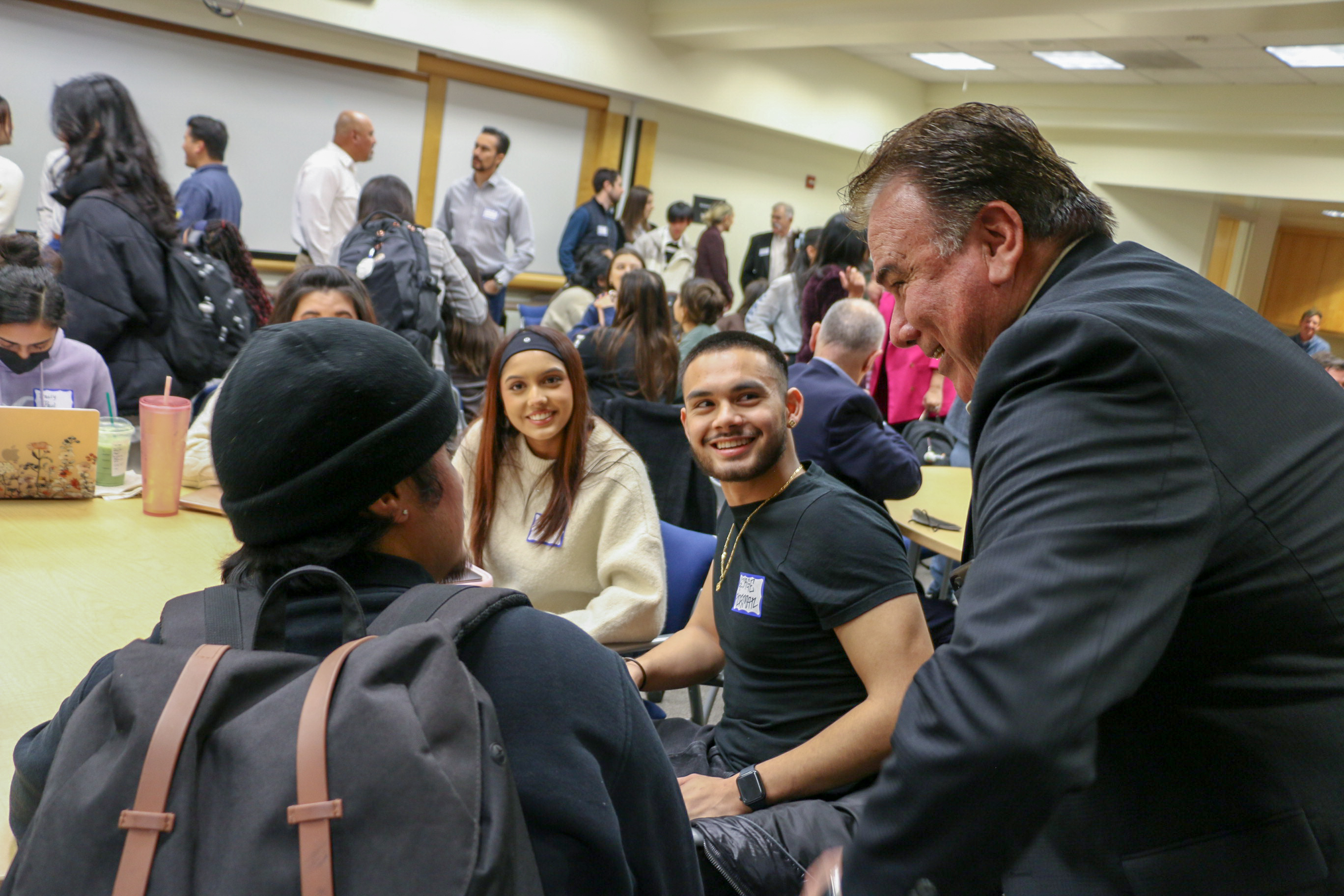 Students and professionals network at a CLI session