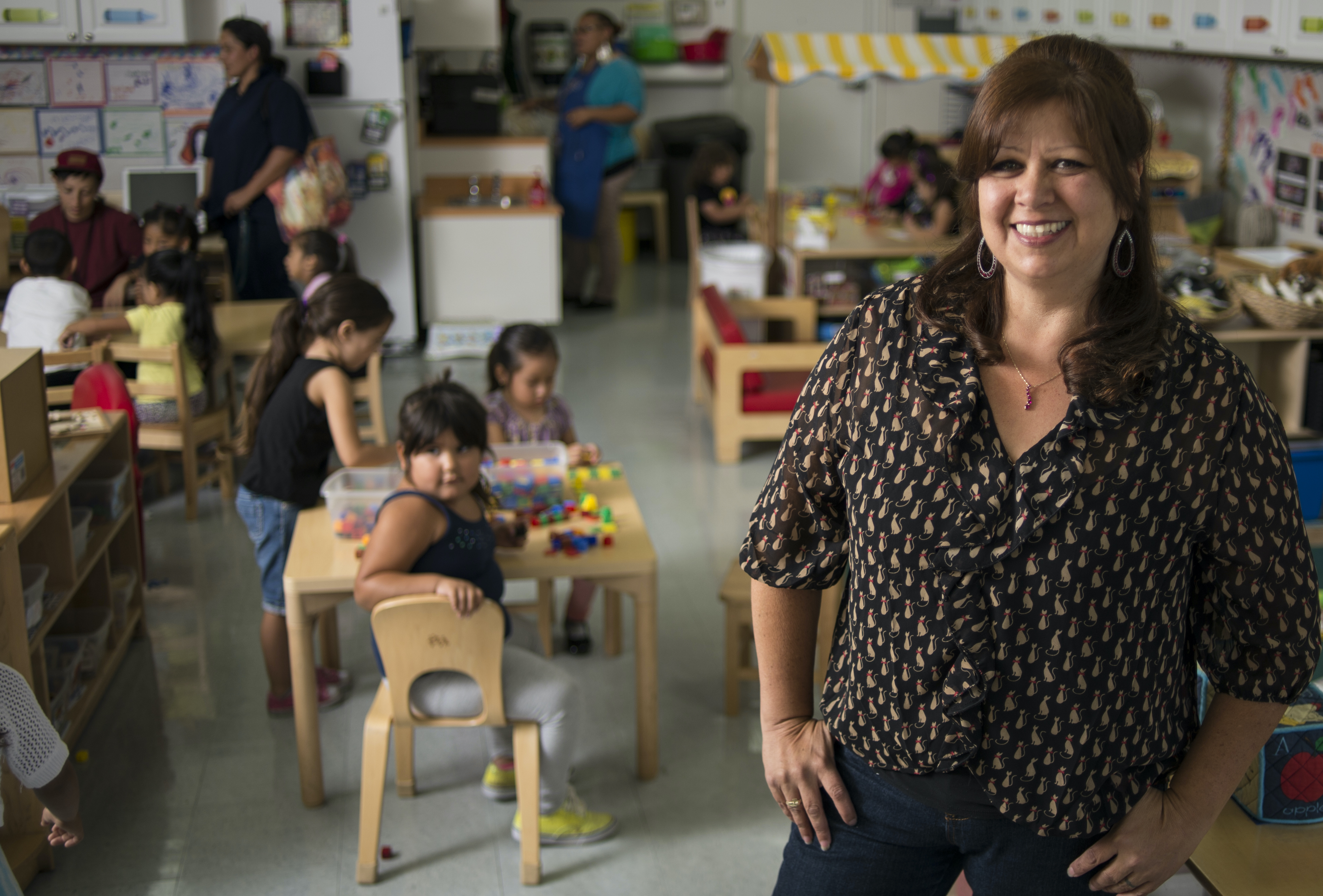 Teacher in classroom with children