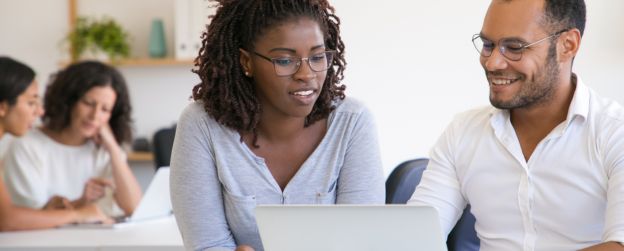 Two People looking at a computer