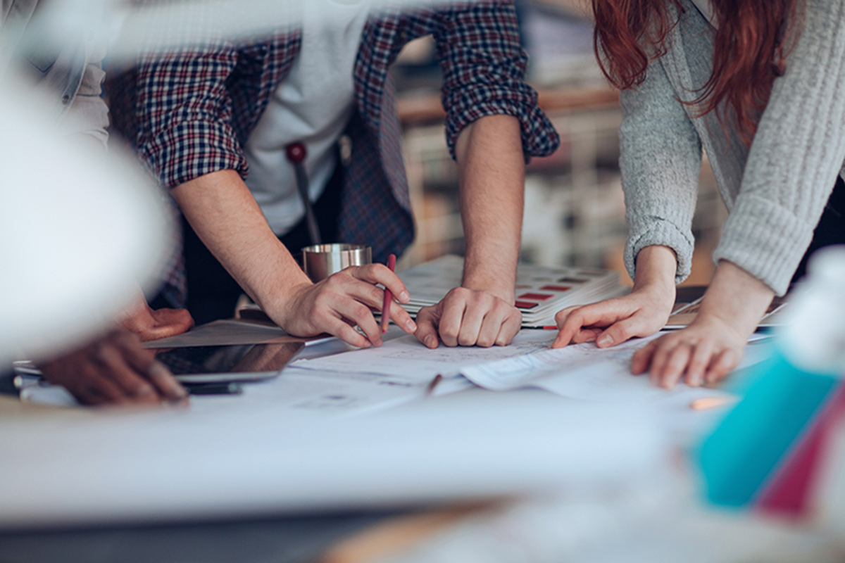 students with hands on table